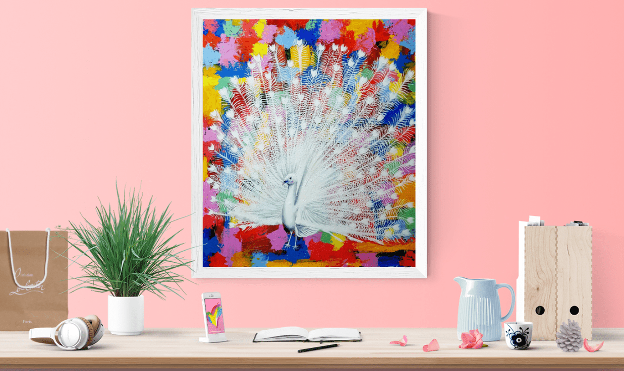 An abstract painting of a peacock on a pink wall with a desk in front covered with accessories.