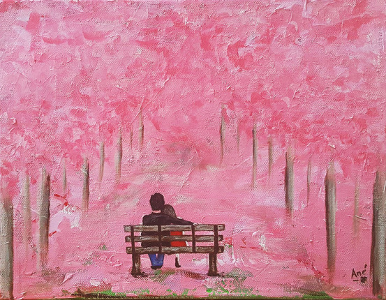 A young man and a young woman sitting on a bench in a cherry blossom park.